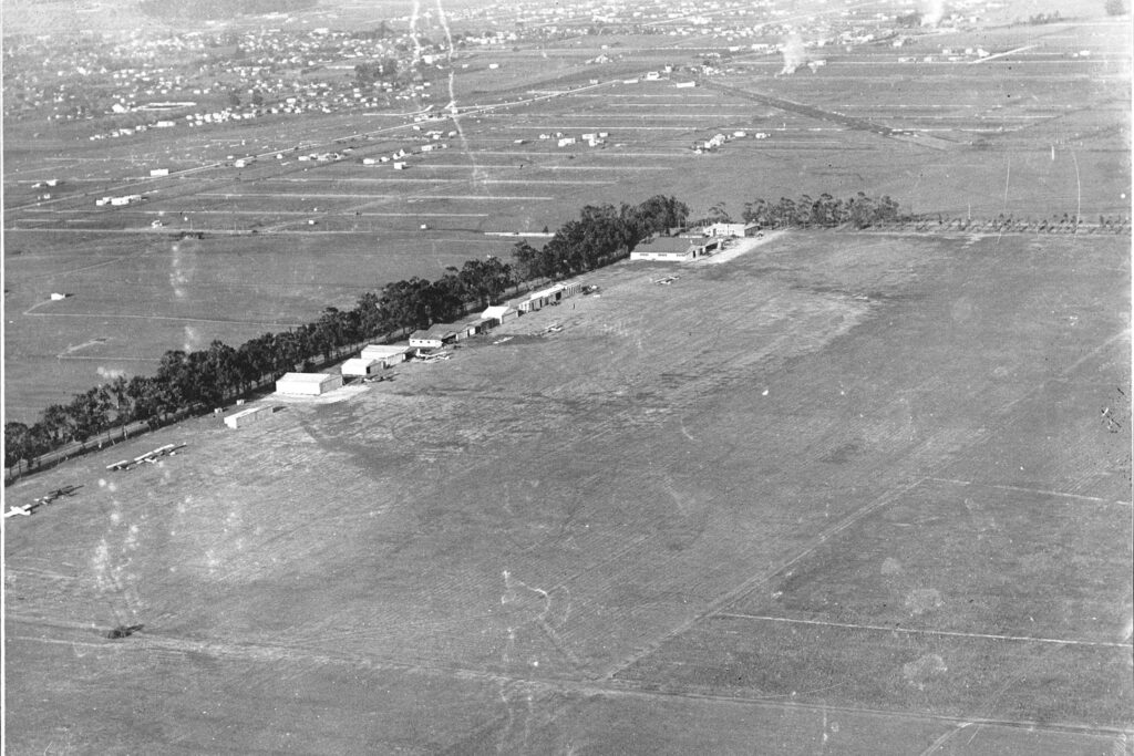 Aerial view of Clover Field Airport in Santa Monica, showing residences in the distance, 1924. Photo courtesy University of Southern California Libraries and California Historical Society