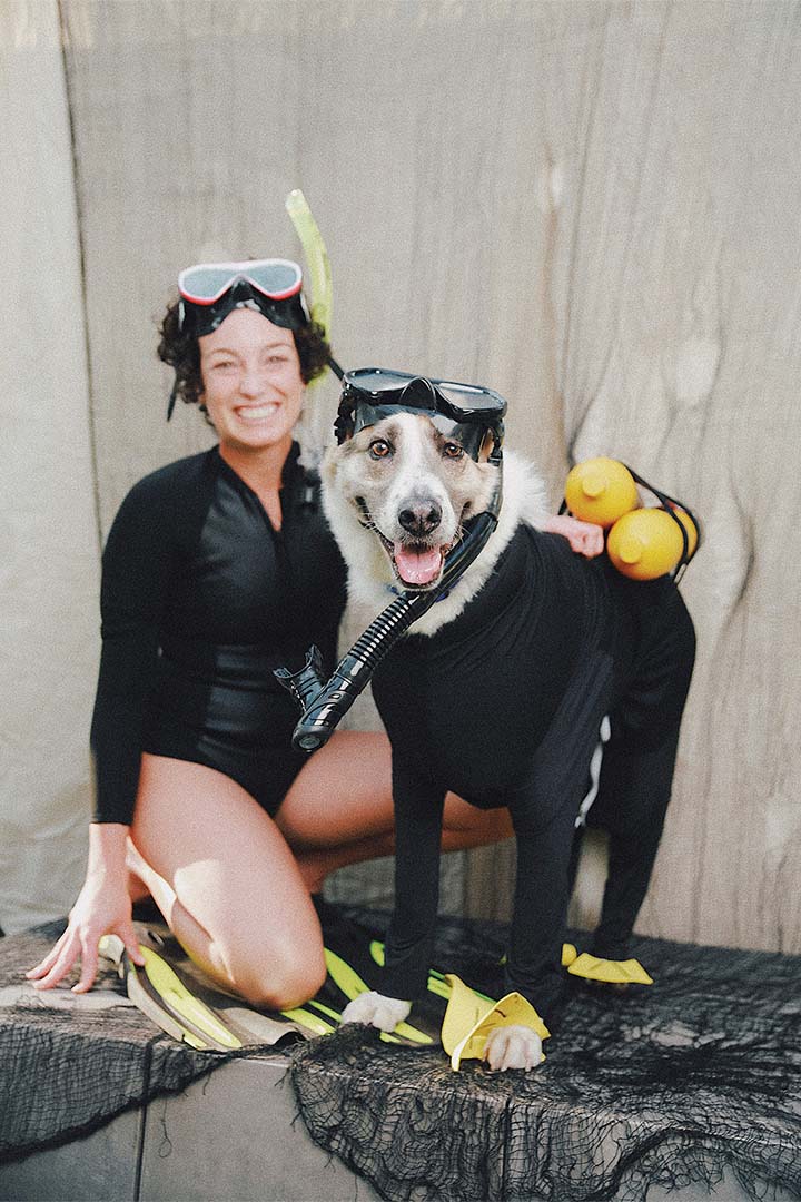 a person and dog wearing scuba gear