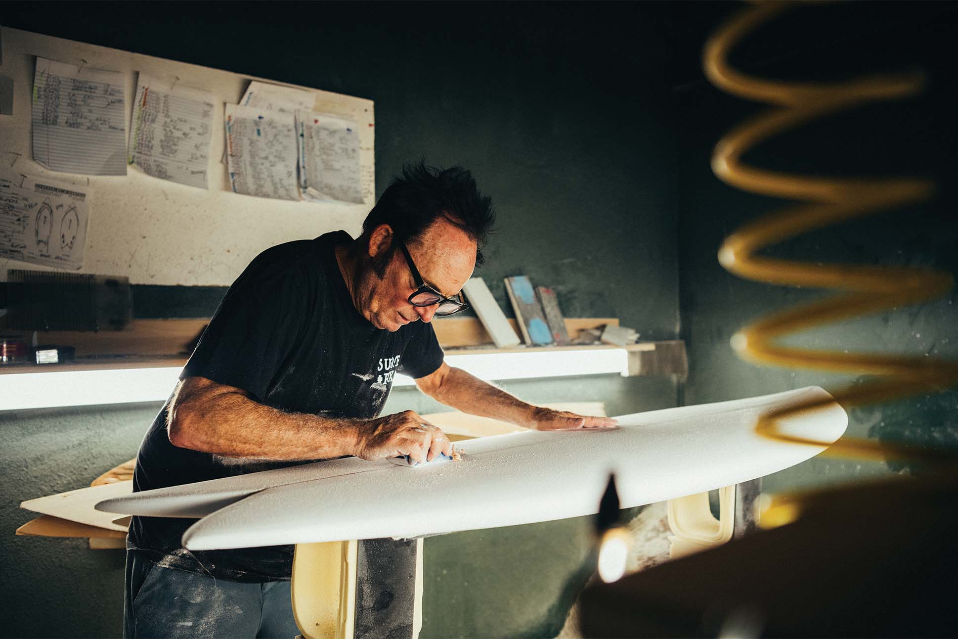 a person working on a surfboard